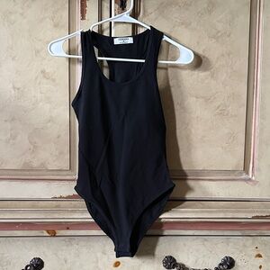 New in bag. Zenana Black Racerback Bodysuit Size Small